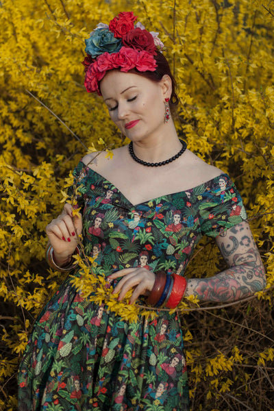A model wearing Frida Kahlo Inspired Off Shoulder Dress