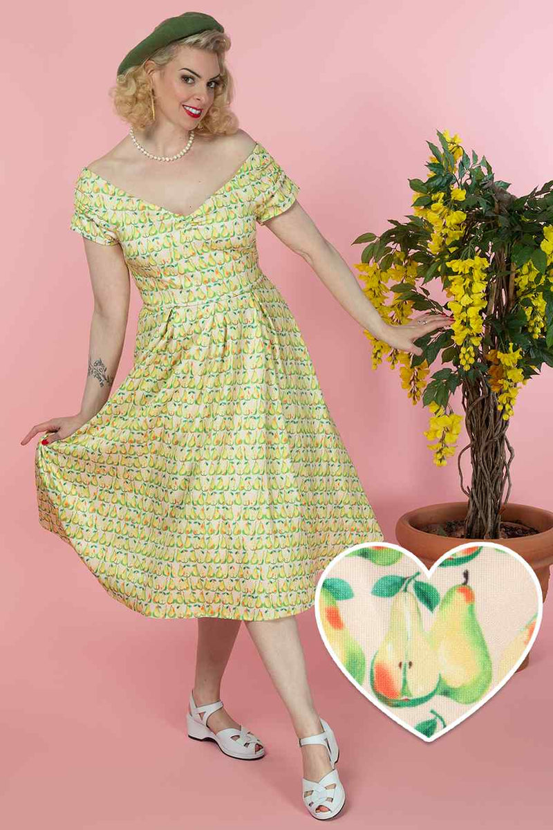 A lady wearing a Fruity Pear Off Shoulder Dress