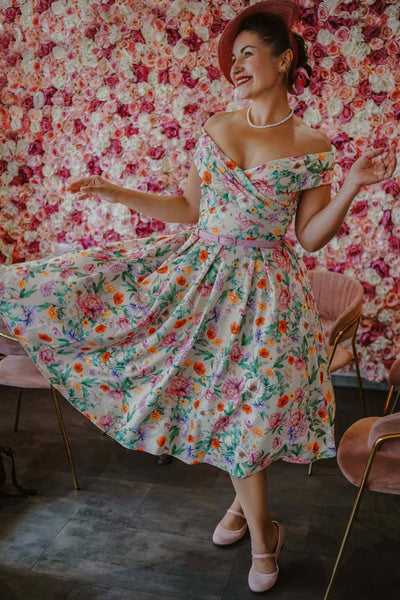 A lovely woman in Beverly Garden Floral Off Shoulder Dress In Mint Green 