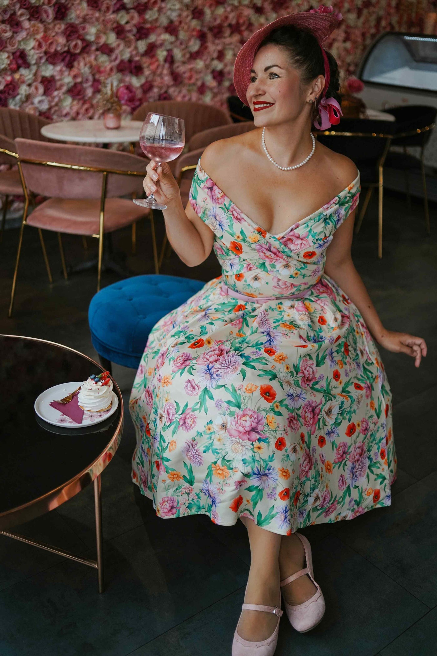 A woman in Beverly Garden Floral Off Shoulder Dress In Mint Green 