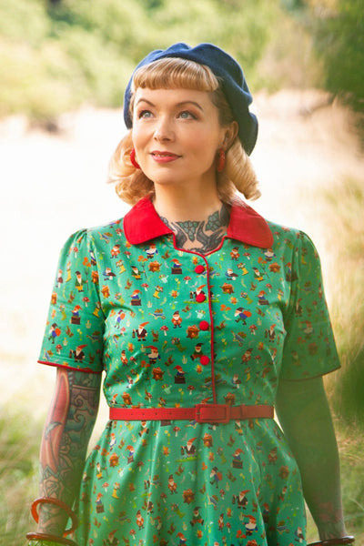 A model wearing a Garden Gnome Shirt Dress In Green