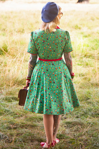 A model wearing a Garden Gnome Shirt Dress In Green