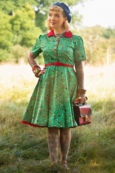 A model wearing a Garden Gnome Shirt Dress In Green