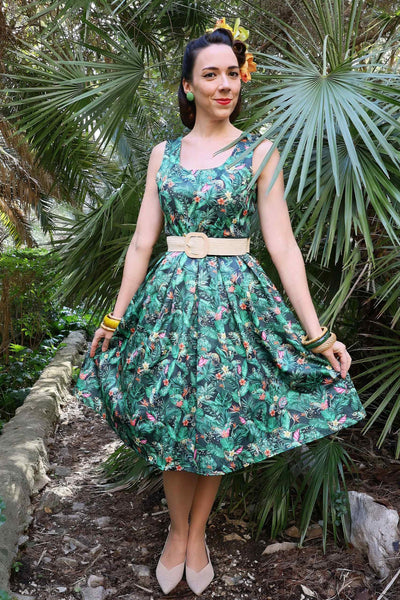 A lady wearing a Green Chameleon Swing Dress
