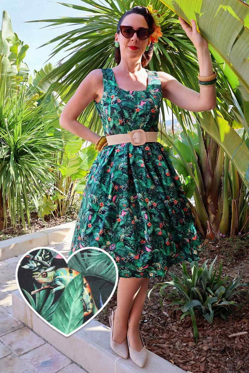 A lady wearing a Green Chameleon Swing Dress
