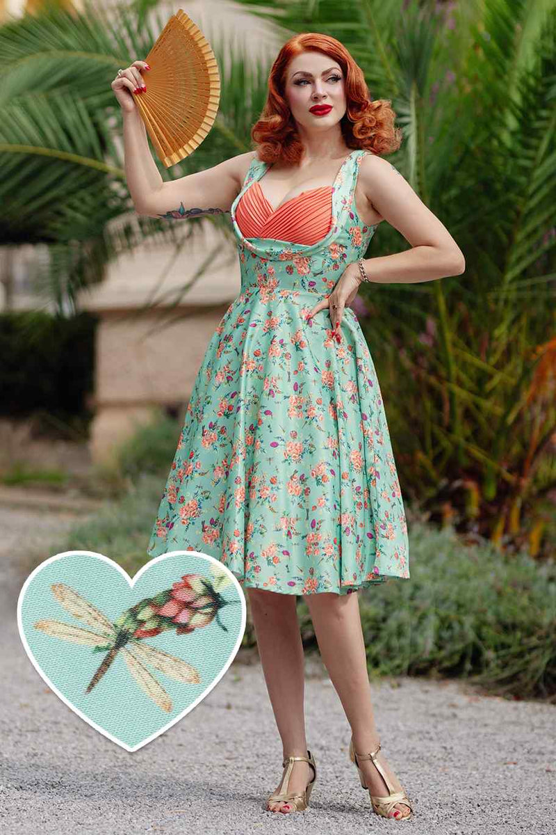 A model wearing Green Floral Dragonfly Pleated Bust Dress