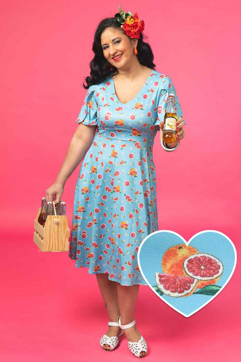 A model wearing a Green Grapefruit Petal Sleeved Tea Dress