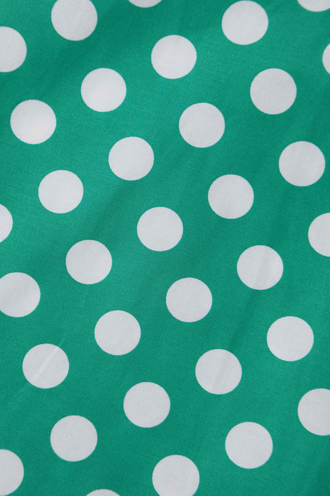Close up view of Green Polka Dot Off Shoulder Dress