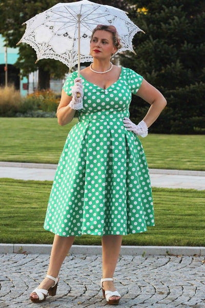 A model wearing a Lily Green Polka Dot Off Shoulder Dress