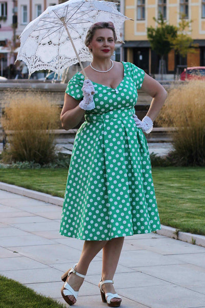A lovely model wearing a Lily Green Polka Dot Off Shoulder Dress