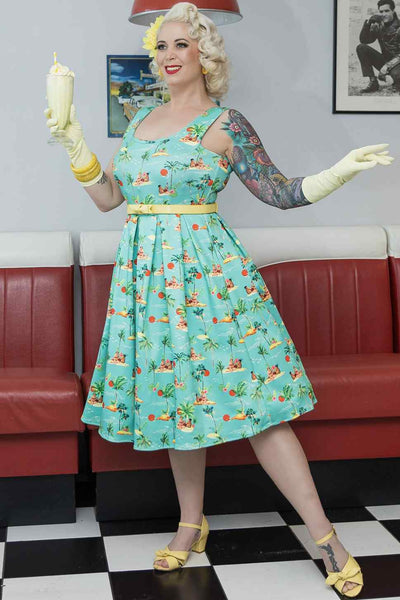 Model wearing Turquoise Sunset Pinup Couple Swing Dress