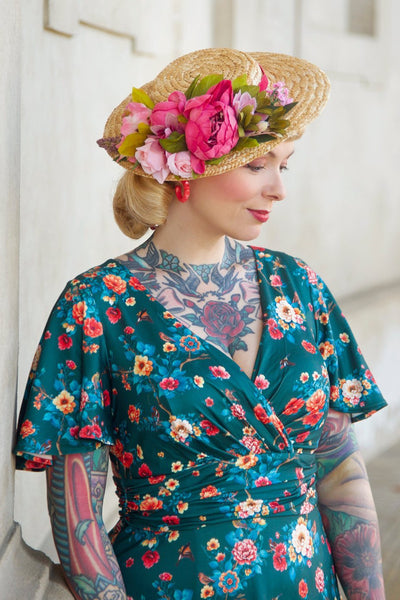 A model wearing a Green Vintage Floral Crossover Bust Dress