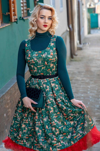 A lady wearing a Green Woodland Fox & Deer Dress