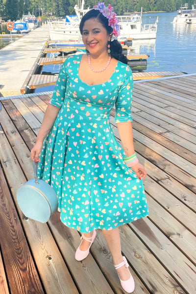 A model wearing a Green Heart Print Midi Dress
