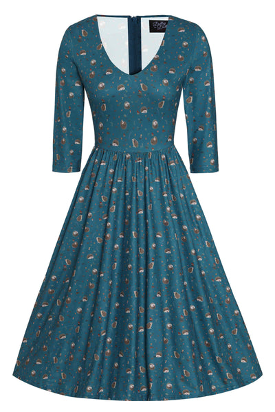 A lady wearing a Green Hedgehog & Mushroom Print Dress