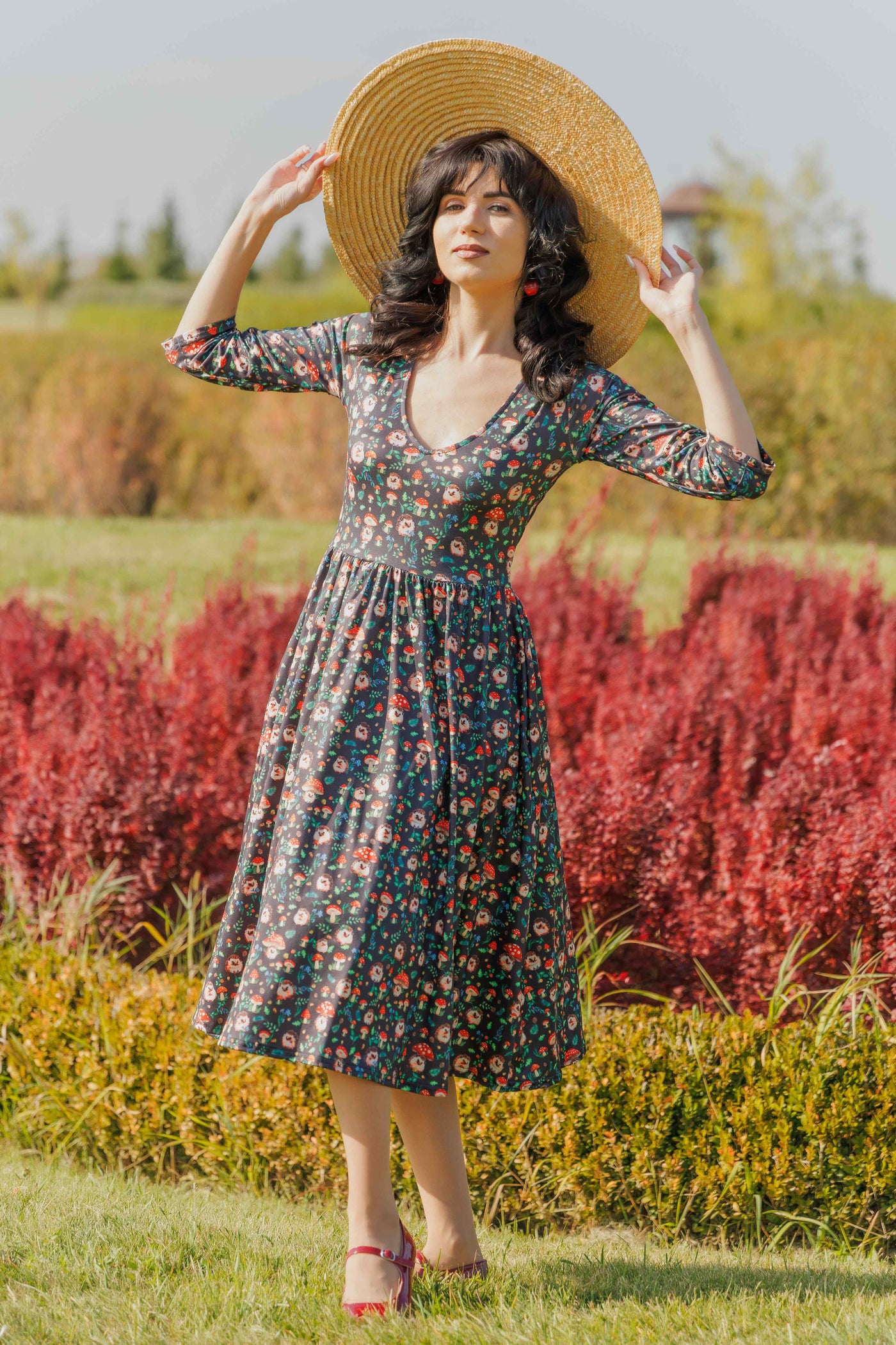 A model wearing a Black Hedgehog & Mushroom Print Dress