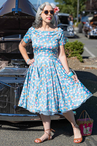 A lady wearing a Hot Air Balloon Blue Swing Dress