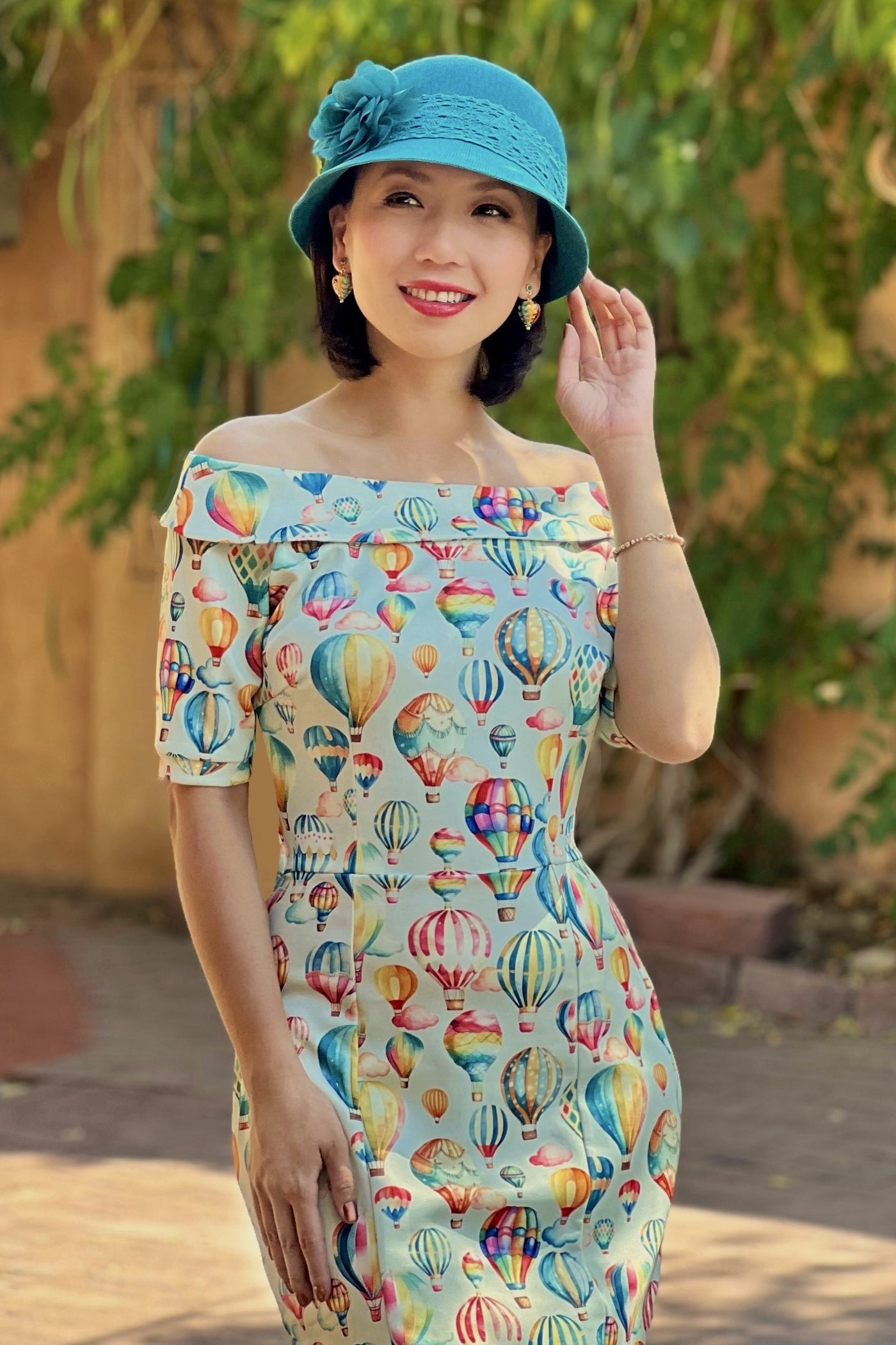 A model wearing a Hot Air Balloon Fitted Off Shoulder Dress