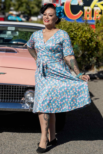 A lady wearing a Hot Air Balloon Wrap Dress In Blue