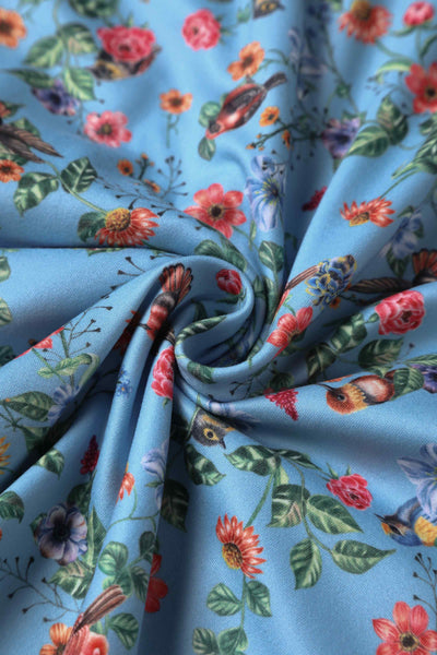 Close up view of Hummingbird Print Long Sleeved Dress in Blue