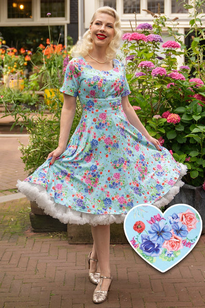 A lady wearing a  Light Blue Hydrangea Dress