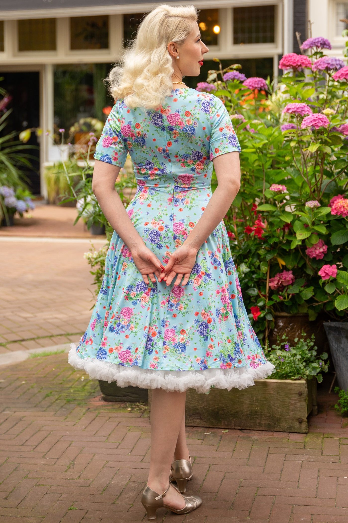 A lady wearing a  Light Blue Hydrangea Dress