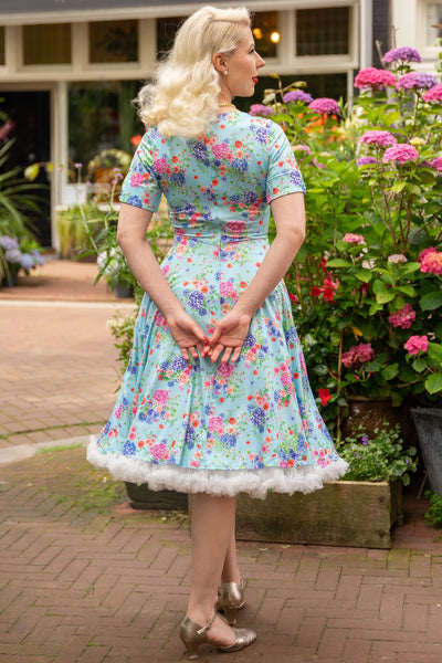 A lady wearing a  Light Blue Hydrangea Dress