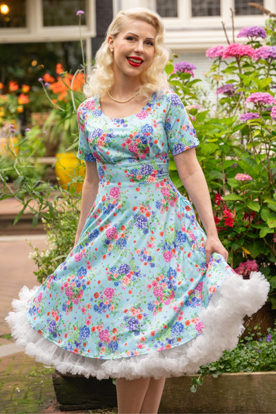 A lady wearing a  Light Blue Hydrangea Dress