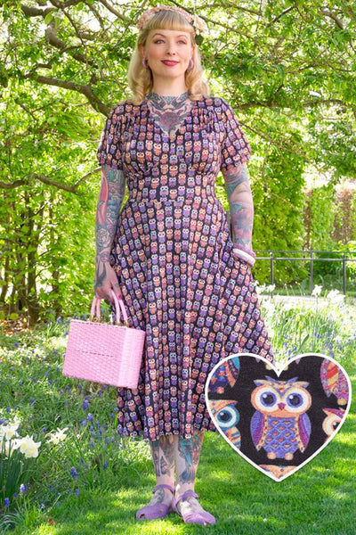 A model wearing Black Midi Dress in Aztec Owl Print