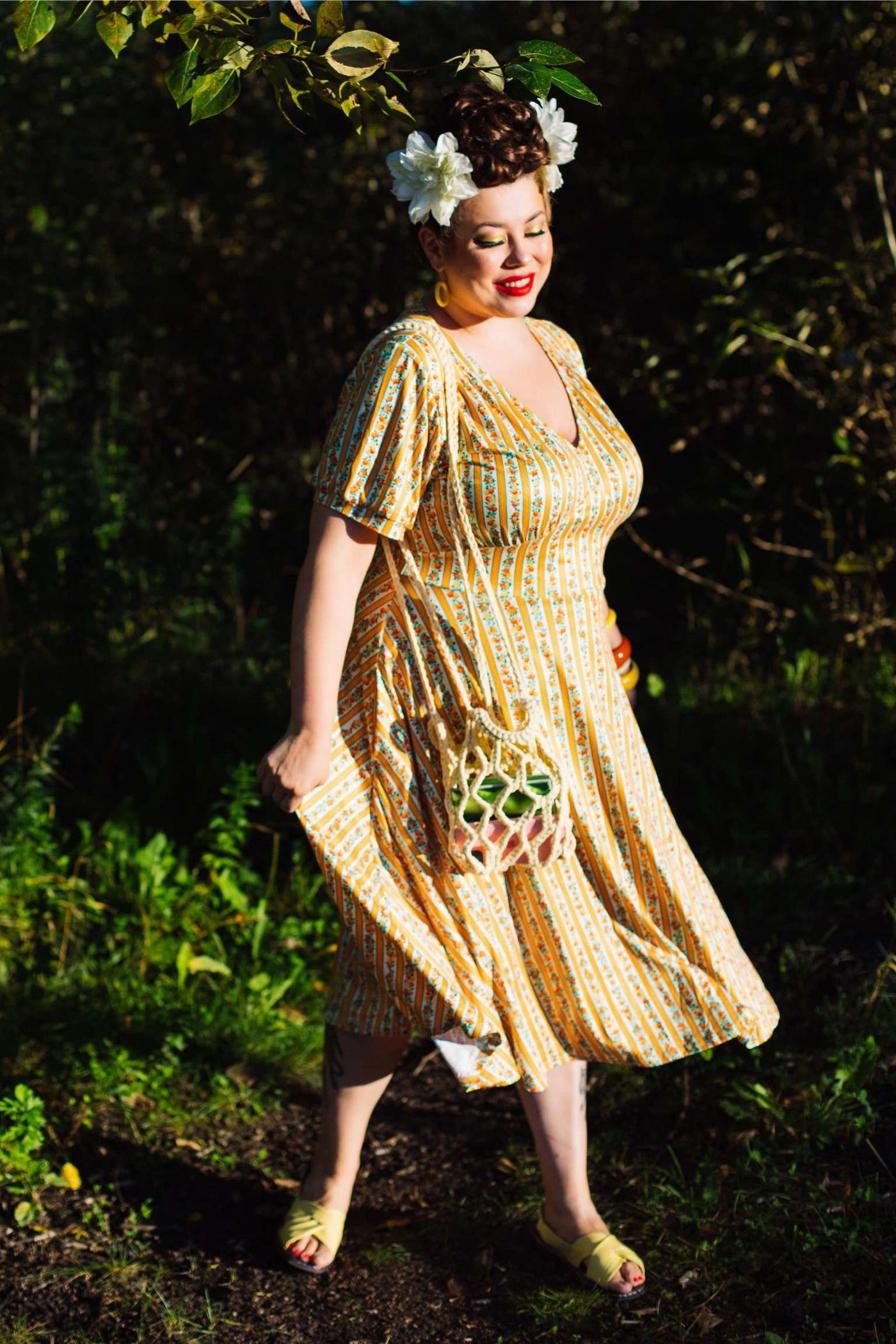 A woman wearing Julia Sicilian Orange Midi Dress
