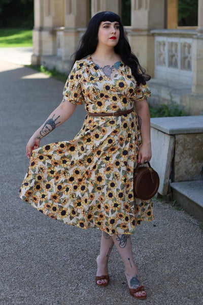 A lovely model wearing a Julia Sunflower Midi Dress