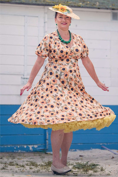 A woman wearing a Julia Sunflower Midi Dress