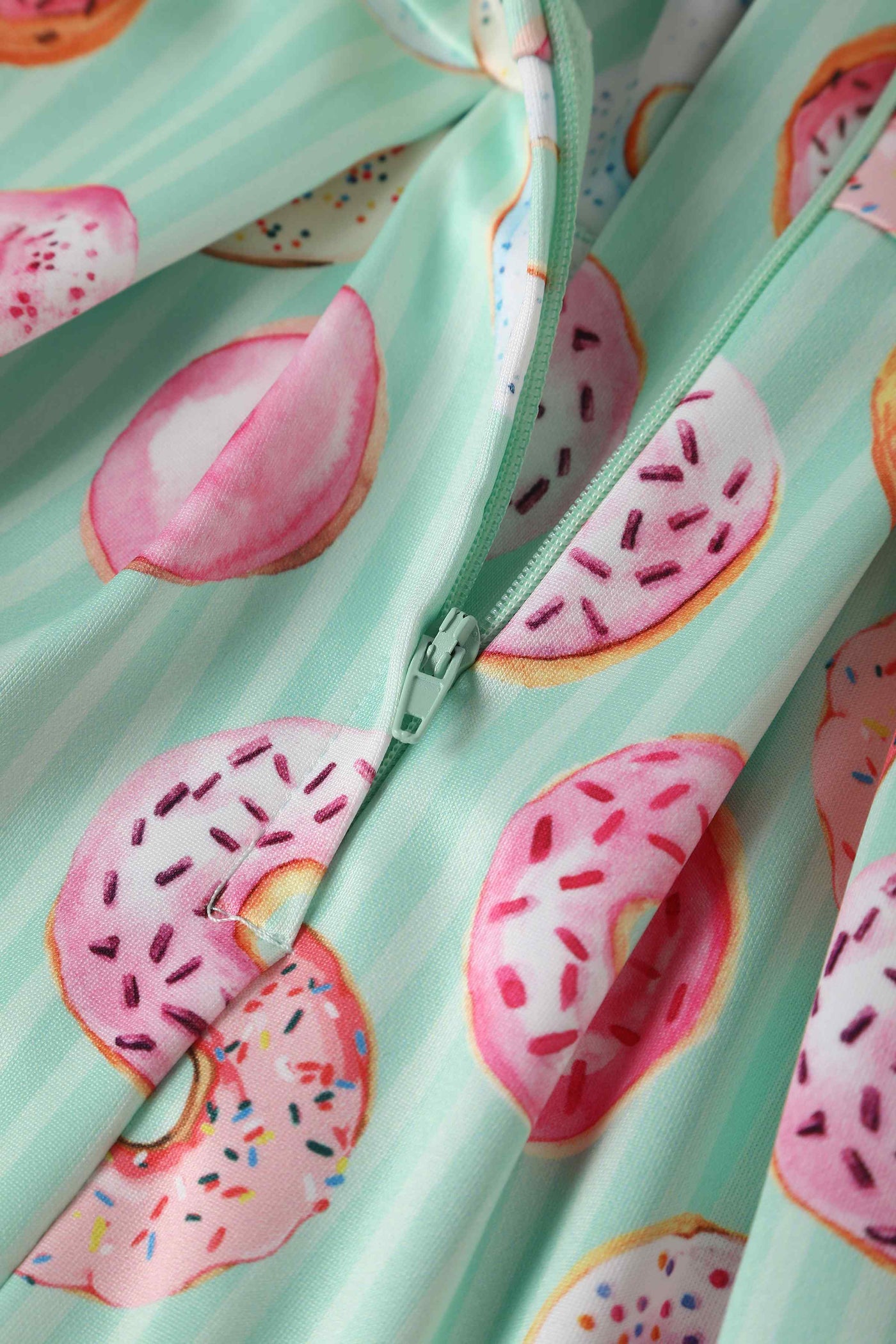 Close up view of Kids Donut Green Swing Dress