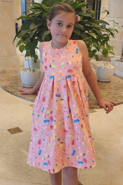 A pretty girl wearing a Kids Pink Ice Lolipop Flared Dress