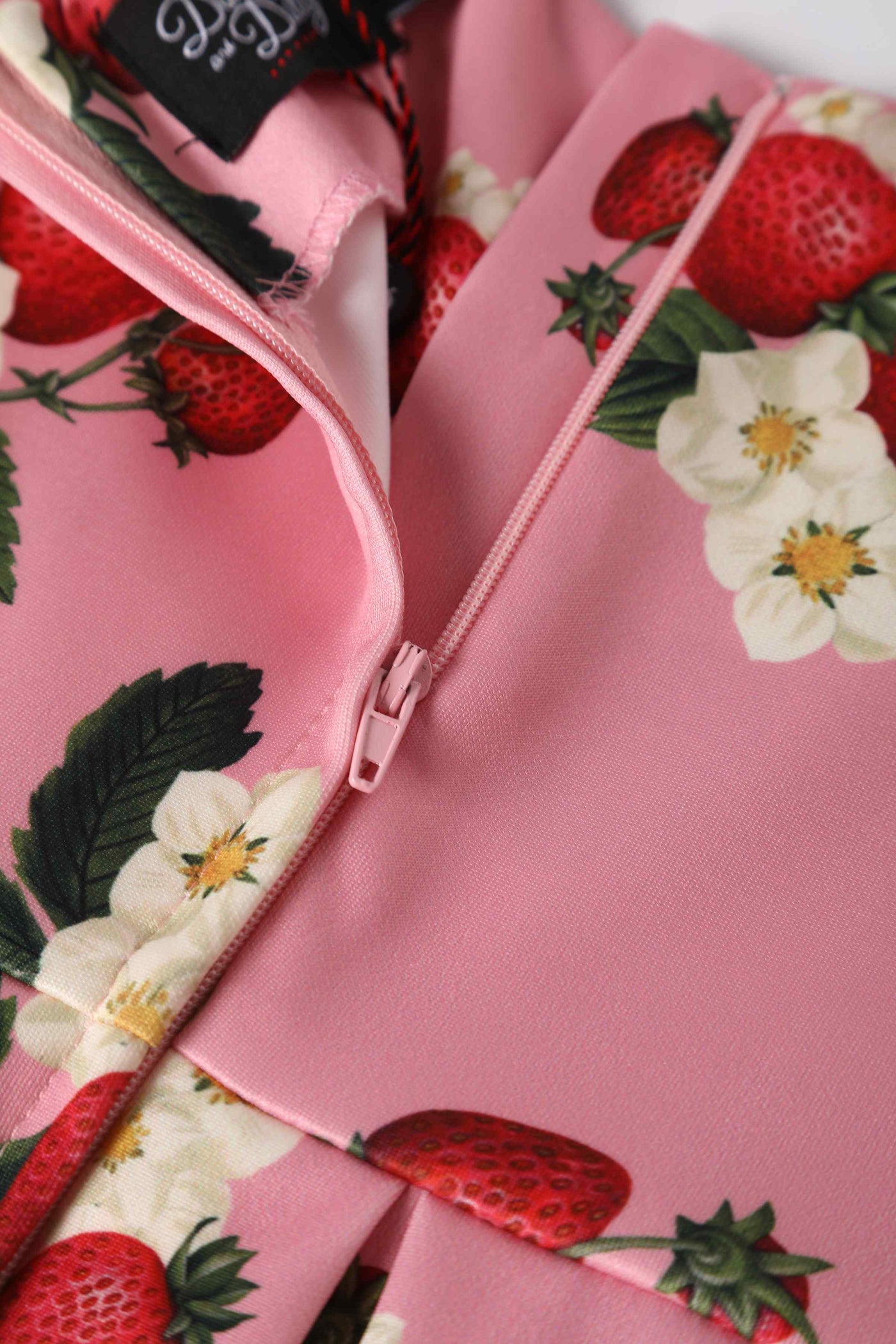 Close up view of Kids Pink Strawberry Swing Dress