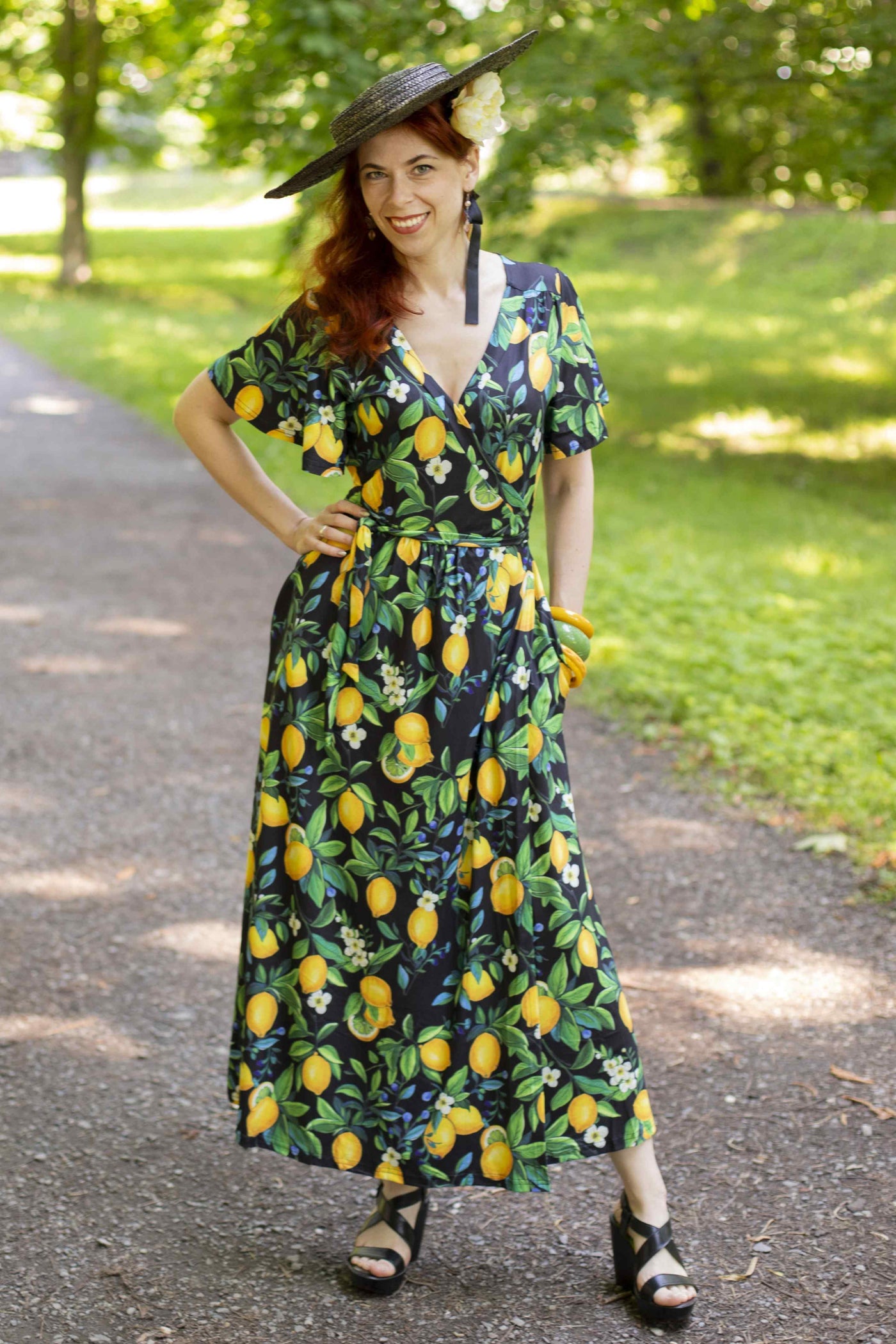 A lovely lady wearing a Lemon Maxi Wrap Dress