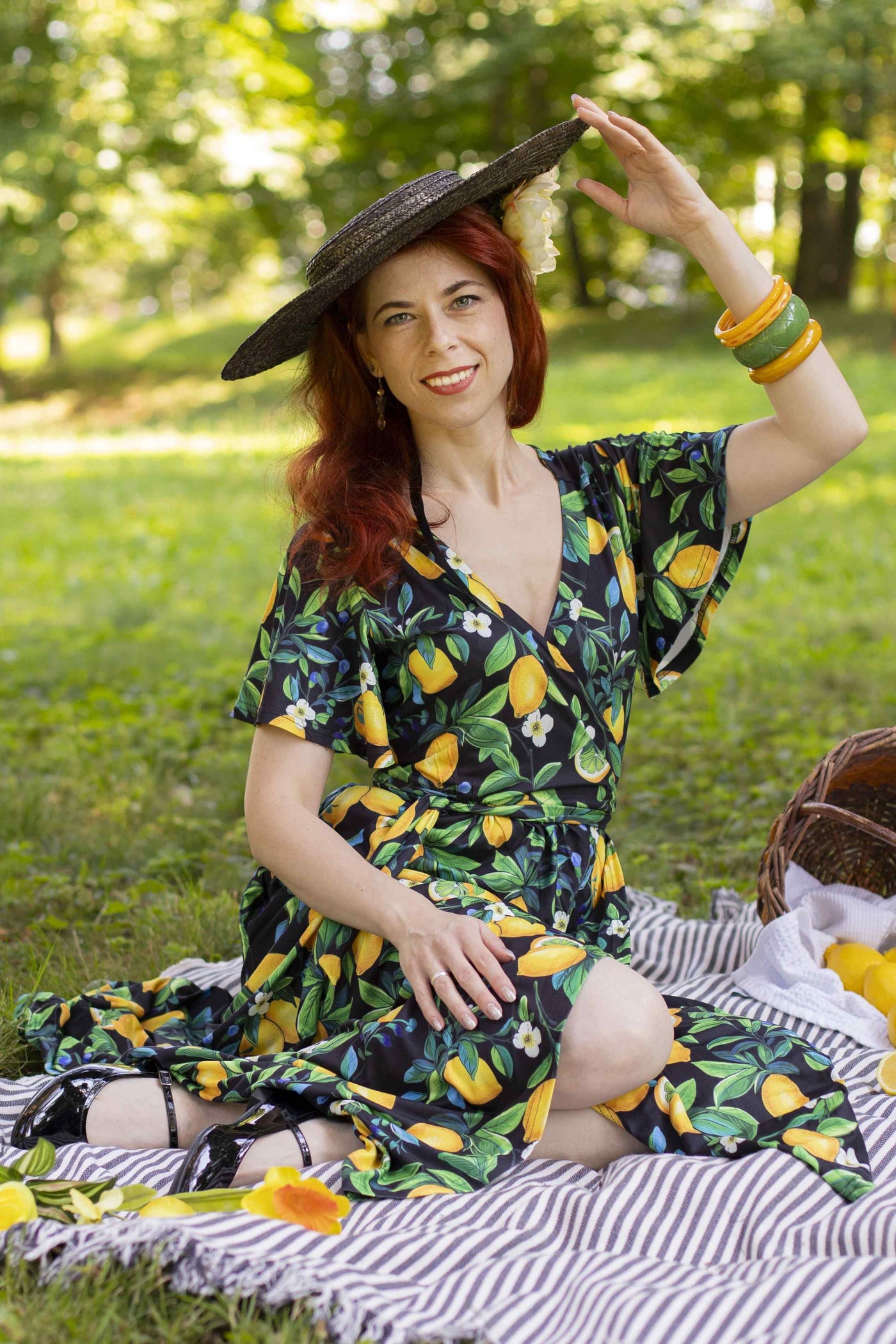 A lady wearing a Lemon Maxi Wrap Dress