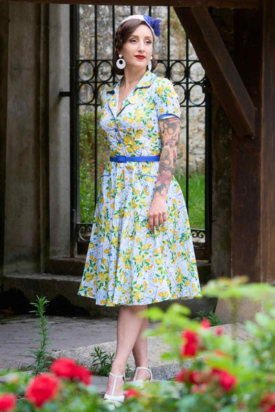 A model wearing a Mabel Mediterranean Lemon Midi Shirt Dress In White