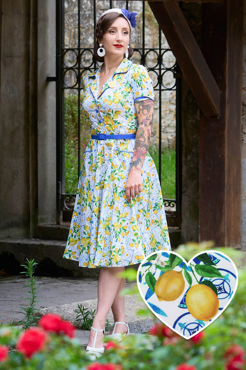 A model wearing a Mabel Mediterranean Lemon Midi Shirt Dress In White