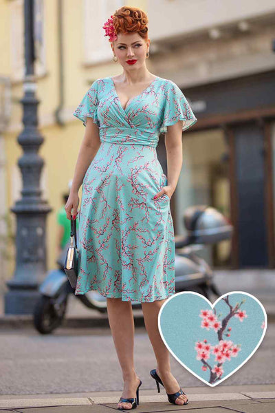 A model wearing a Light Blue Cherry Blossom Tea Dress