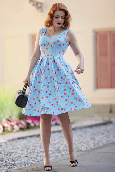 A model wearing a Light Blue Poppy Swing Dress