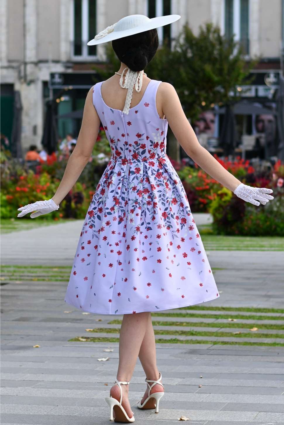 A woman wearing an Amanda Lilac Falling Flower Swing Dress