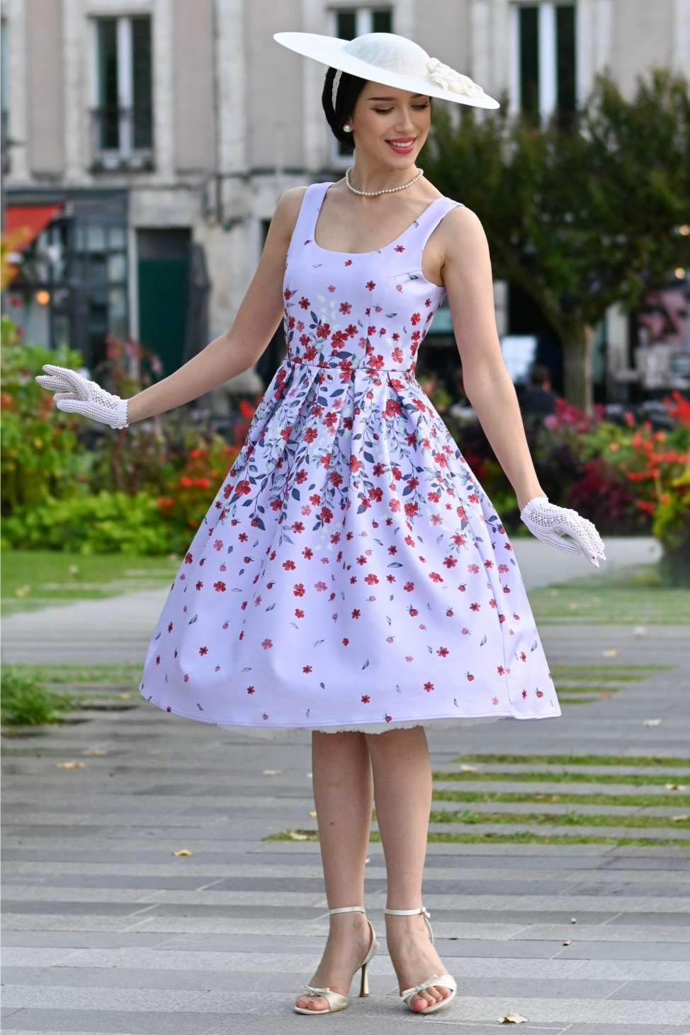 A lovely model wearing an Amanda Lilac Falling Flower Swing Dress