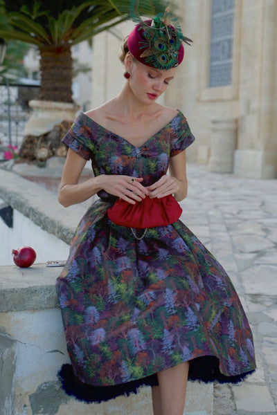 A lovely model wearing a Lily Autumn Foliage Off Shoulder Dress
