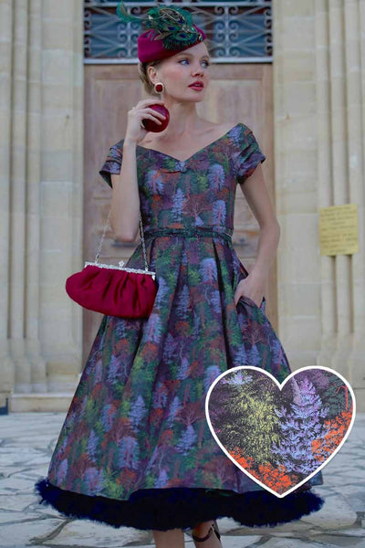 A model wearing a Lily Autumn Foliage Off Shoulder Dress