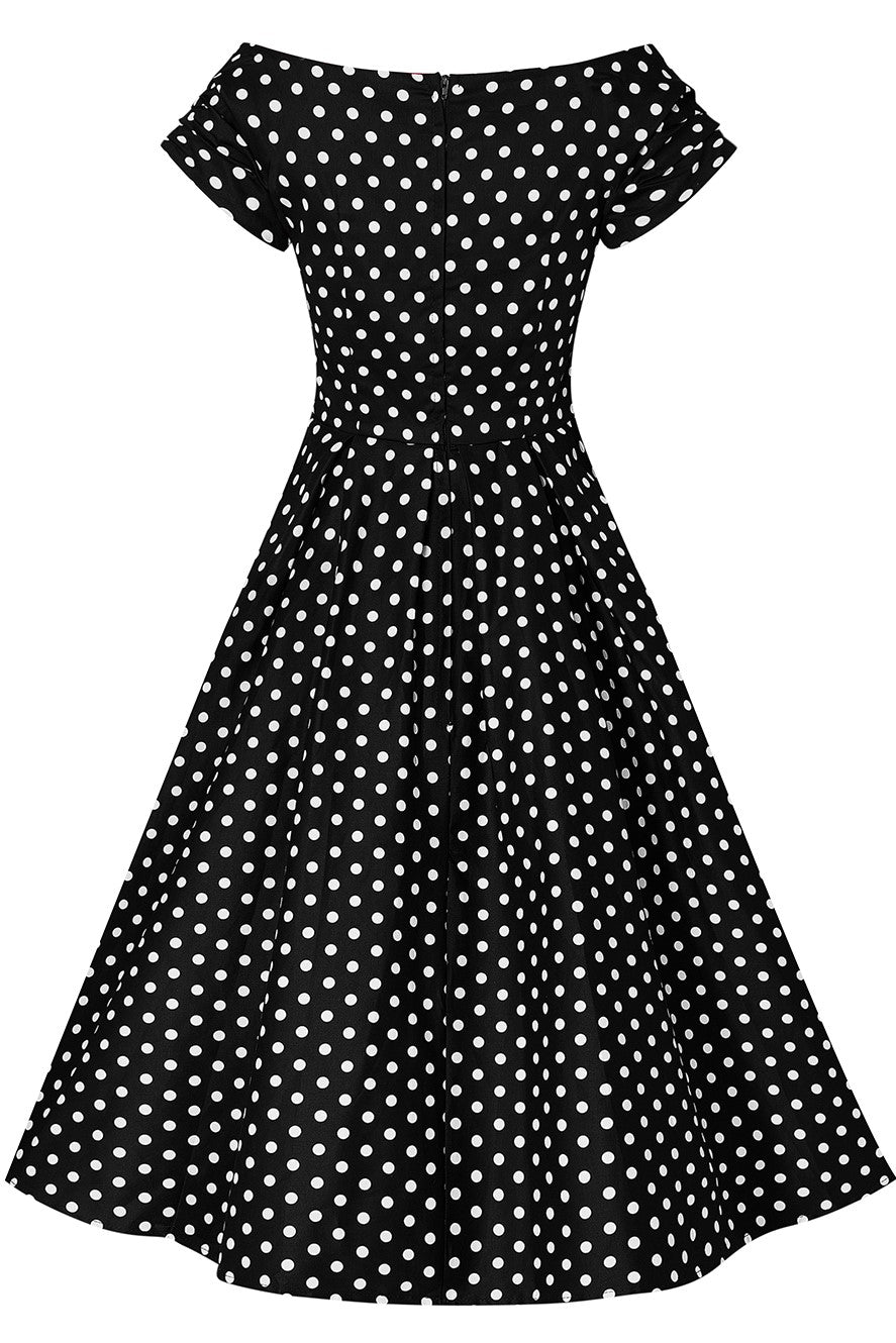 Back view of Lily Black Swing Dress With White Polka Dots