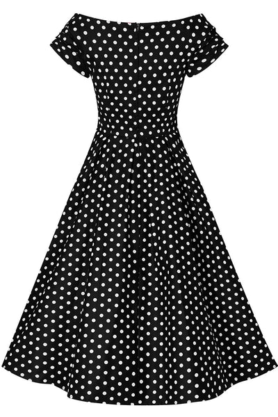 Back view of Lily Black Swing Dress With White Polka Dots