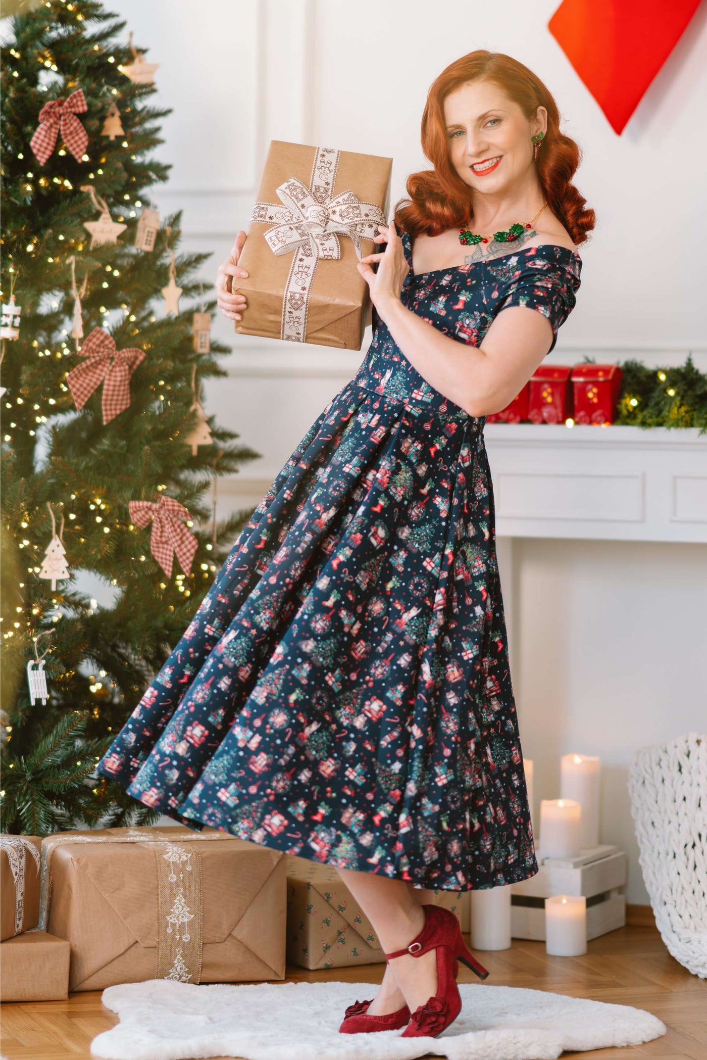 A lady wearing a Lily Cats At Christmas Circle Dress