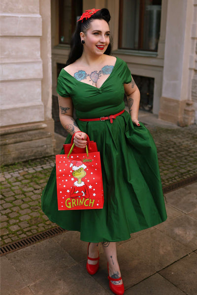 A lovely woman wearing a Lily Dark Green Off Shoulder Dress