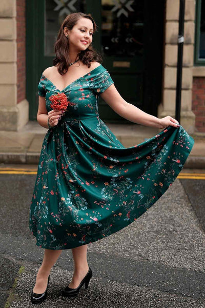 A model wearing a Lily Green Bird Forest Off Shoulder Swing Dress